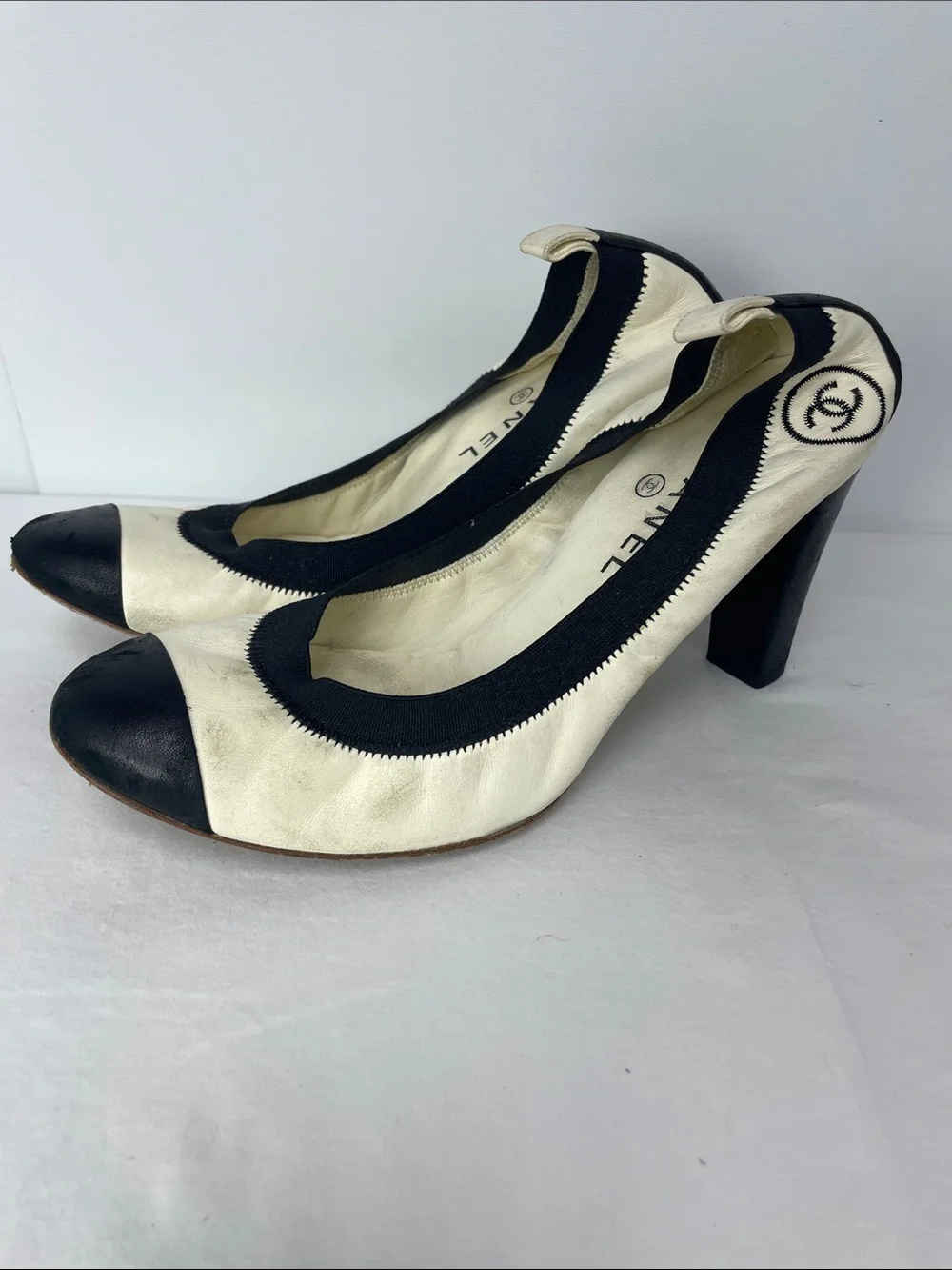 CHANEL Black & White Cap-Toe Leather Pumps